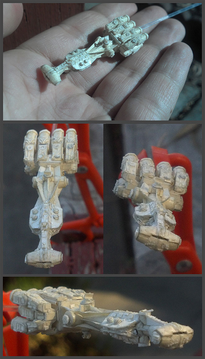 Four views. Clockwise from top: The ship sitting in my palm for scale (almost as long as a finger).  Front view. Front side three-quarters view. Top view.