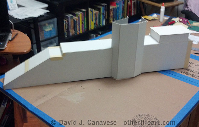 Showing the beginning of construction. The base, from which both towers will eventually rise, is complete, but with no detail. The lowest part of the tower seen at right in pictures above is under construction. The left tower has not yet been built at all.