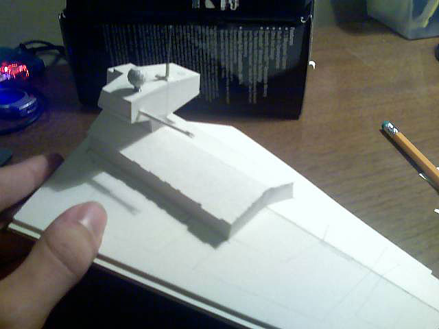 The main upper hull is assembled, but not detailed. The first layer of the superstructure is complete, but not the second. The winglets on either side of the main hull are not yet in place. One sensor globe is missing.